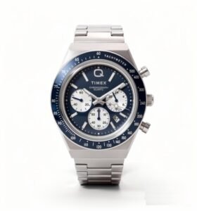 Timex Q Chronograph with leather strap, retro analog watch on wooden surface,